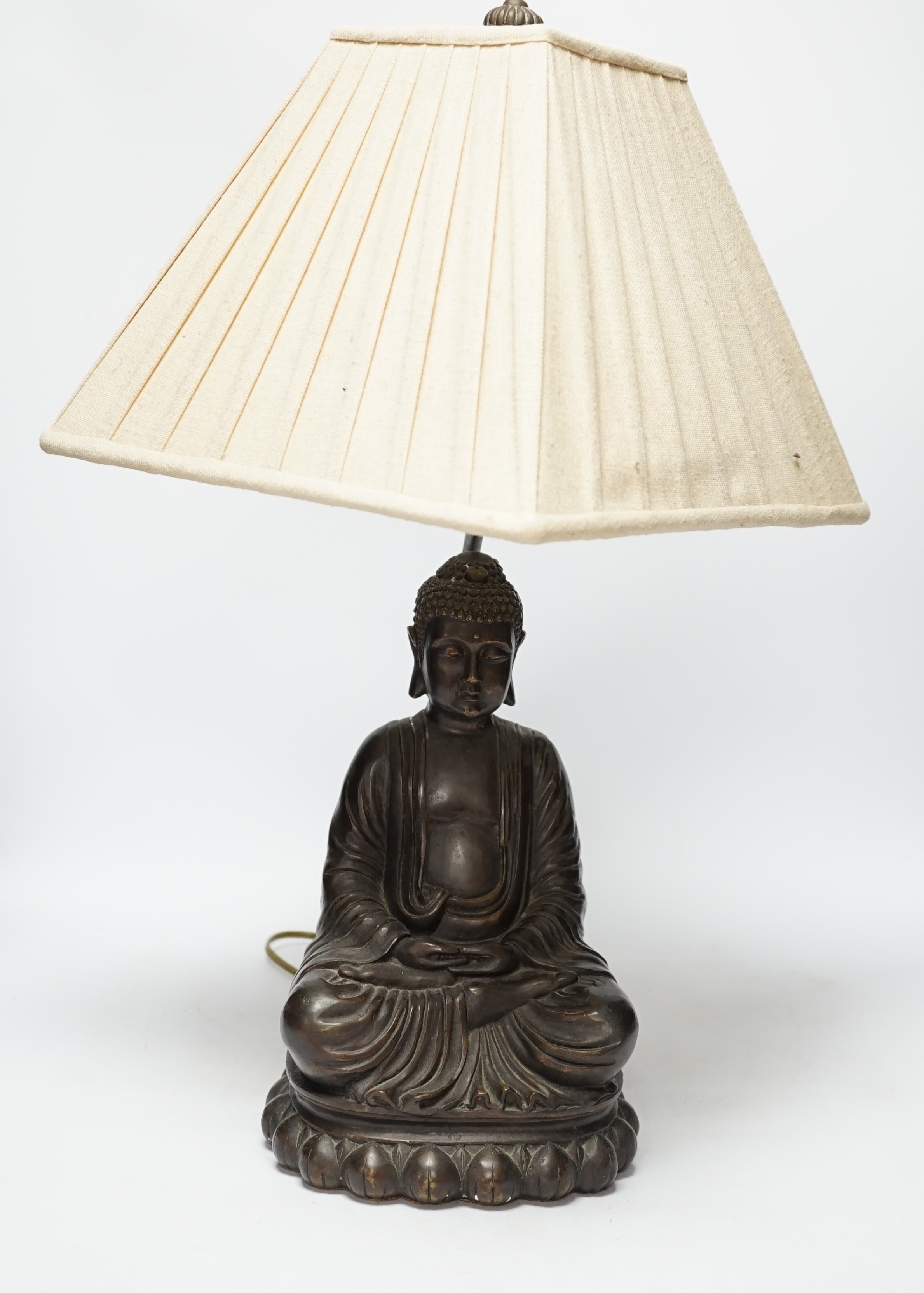 A bronzed Buddha table lamp, 57cm high including shade